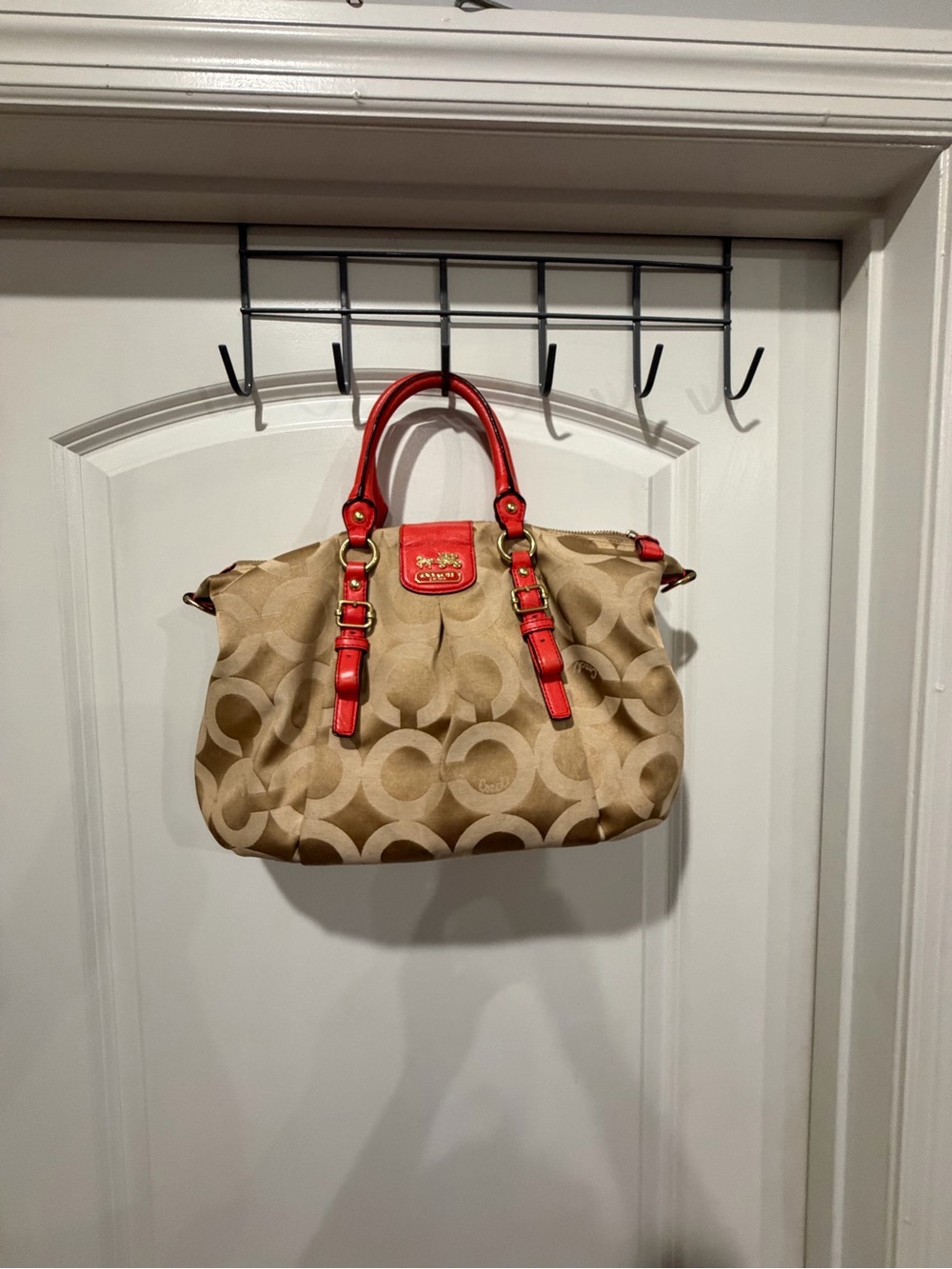 Coach Beige Signature Canvas Satchel with orange Trim and Handles. No strap